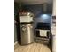 Stainless steel refrigerator and range provide modern amenities and a sleek aesthetic at 818 S Grant St, Muncie, IN 47302