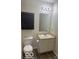 Traditional bathroom features a sink, vanity, and a commode at 8249 Retreat Ln, Indianapolis, IN 46259