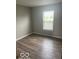 Bedroom with new flooring and natural light, ready for personalization at 8249 Retreat Ln, Indianapolis, IN 46259