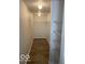 Walk-in closet with shelves and railing for optimal storage solutions at 8249 Retreat Ln, Indianapolis, IN 46259