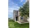 Inviting home with a well-manicured lawn, complemented by a lush green tree at 8249 Retreat Ln, Indianapolis, IN 46259