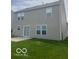 Exterior shot of house with sliding door access to a well-maintained backyard at 8249 Retreat Ln, Indianapolis, IN 46259