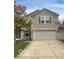 Charming two-story home featuring a spacious two car garage and well-maintained lawn at 8249 Retreat Ln, Indianapolis, IN 46259
