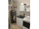 Functional laundry room with modern appliances and storage cabinets, facilitating efficient chores at 8249 Retreat Ln, Indianapolis, IN 46259
