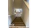 Carpeted staircase leads to the upper level, providing a transition between floors at 8249 Retreat Ln, Indianapolis, IN 46259