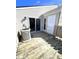 Wooden deck featuring an air conditioning unit, sliding glass doors and an exterior door at 8315 Woodall Dr, Indianapolis, IN 46268