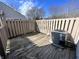 Outdoor living space featuring a weathered deck and an air conditioning unit at 8315 Woodall Dr, Indianapolis, IN 46268