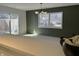 Open dining room and living space with sliding glass doors, accent wall, and plenty of natural light at 8315 Woodall Dr, Indianapolis, IN 46268