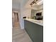 Modern kitchen featuring stainless steel appliances, a breakfast bar, and light wood flooring at 8315 Woodall Dr, Indianapolis, IN 46268