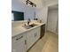 Modern kitchen with stainless steel appliances, white cabinets, and updated fixtures and countertops at 8315 Woodall Dr, Indianapolis, IN 46268