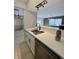 Kitchen sink features stainless steel basin, white counters, and black hardware at 8315 Woodall Dr, Indianapolis, IN 46268