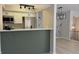 Eat-in kitchen featuring stainless steel appliances, white cabinets, and breakfast bar at 8315 Woodall Dr, Indianapolis, IN 46268