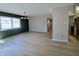 Spacious living room featuring new flooring, large window, and a view of the adjacent kitchen at 8315 Woodall Dr, Indianapolis, IN 46268