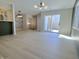 Open concept living room with access to a patio, dining area, and kitchen at 8315 Woodall Dr, Indianapolis, IN 46268