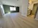 Bright living room offers access to the kitchen and a sliding glass door at 8315 Woodall Dr, Indianapolis, IN 46268