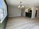 Open concept living room with an eat-in kitchen and natural light at 8315 Woodall Dr, Indianapolis, IN 46268