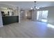 Open living space with modern accents, leading to a stairway, kitchen, and sliding glass doors at 8315 Woodall Dr, Indianapolis, IN 46268