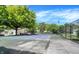 Well-maintained tennis courts within a beautiful community featuring lush greenery and mature trees at 8315 Woodall Dr, Indianapolis, IN 46268