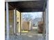 View of a covered brick walkway leading to the backyard, providing a private entrance at 8315 Woodall Dr, Indianapolis, IN 46268