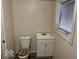 A simple full bathroom with a toilet and a sink with vanity at 905 N Sheffield Ave, Indianapolis, IN 46222