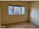 Cozy bedroom featuring a big window with a view of a neighborhood at 905 N Sheffield Ave, Indianapolis, IN 46222