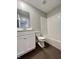 Bright bathroom features a white vanity, toilet, and a tiled shower with a tub at 9616 Beckett St, Avon, IN 46123