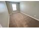This carpeted bedroom features one bright window with horizontal blinds and neutral walls at 9616 Beckett St, Avon, IN 46123