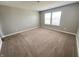 Inviting bedroom featuring neutral carpeting and windows with natural light at 9616 Beckett St, Avon, IN 46123