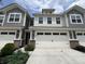 Charming townhome featuring a two-car garage, gray siding, and inviting curb appeal at 9616 Beckett St, Avon, IN 46123