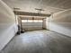 Empty two car garage with an automatic garage door at 9616 Beckett St, Avon, IN 46123