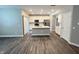 Modern kitchen with white cabinets, stainless steel appliances, and a stylish kitchen island at 9616 Beckett St, Avon, IN 46123
