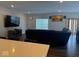 Open living room with hardwood floors and a wall-mounted television at 10218 Cliff Ln, Indianapolis, IN 46239