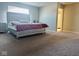 Spacious main bedroom with neutral walls, carpet, and a decorative bed frame at 10218 Cliff Ln, Indianapolis, IN 46239
