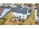 Overhead view of a home's backyard with patio seating and manicured lawn, ideal for outdoor living at 11185 Beardsley Way, Fishers, IN 46038
