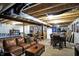 Finished basement features an entertainment area, game tables and seating areas at 11185 Beardsley Way, Fishers, IN 46038