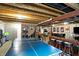 Finished basement featuring an entertainment area, ping pong table and bar seating at 11185 Beardsley Way, Fishers, IN 46038