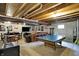 Spacious basement area with ping pong table, lounge seating and entertainment area at 11185 Beardsley Way, Fishers, IN 46038