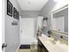 Bathroom with a shower-tub combo, a toilet, and a vanity with a sink and mirror at 11185 Beardsley Way, Fishers, IN 46038
