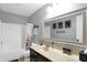 Bathroom featuring a tub-shower combo and a vanity with a sink and mirror at 11185 Beardsley Way, Fishers, IN 46038