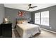 Bedroom featuring a bed, a nightstand, and a window at 11185 Beardsley Way, Fishers, IN 46038