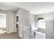 Light-filled foyer boasts an arched window and views of the entry and a bedroom at 11185 Beardsley Way, Fishers, IN 46038