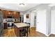 Well-appointed kitchen features an island with seating, stainless appliances, and seamless access to other rooms at 11185 Beardsley Way, Fishers, IN 46038