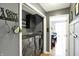 Well-organized laundry room features modern washer and dryer, storage cabinets, and convenient pet accessories at 11185 Beardsley Way, Fishers, IN 46038