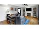 Living room featuring a fireplace, hardwood floors, neutral paint, and ample seating at 11185 Beardsley Way, Fishers, IN 46038