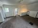View of carpeted attic room with slanted ceilings, white walls, and doorways to other rooms at 1153 Villa Ave, Indianapolis, IN 46203