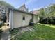 View of backyard featuring grass, an AC unit, and siding exterior at 1153 Villa Ave, Indianapolis, IN 46203