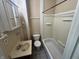 Standard bathroom featuring a shower-tub combo, sink, and toilet, designed for everyday convenience at 1153 Villa Ave, Indianapolis, IN 46203