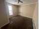 This bedroom features carpet floors, neutral walls, and a large window for natural light at 1153 Villa Ave, Indianapolis, IN 46203