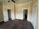 Bedroom featuring neutral walls, providing a blank canvas for personalized decor and ample closet space at 1153 Villa Ave, Indianapolis, IN 46203