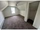 Bright bedroom features carpet flooring, a window, a closet, and white walls at 1153 Villa Ave, Indianapolis, IN 46203